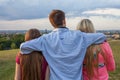 Three friend looking at the city panorama.