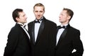 Three friends in a black tuxedo Royalty Free Stock Photo