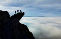 Three friends challenging mountaineering experiences in spectacular mountains Royalty Free Stock Photo