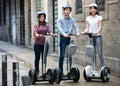 Three friends driving segways