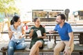 Three friends eating oriental food Royalty Free Stock Photo