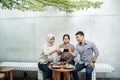 Three friends enjoy coffee together in the coffee shop Royalty Free Stock Photo