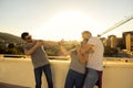 YOUNG PEOPLE CHILLING OUT AND HAVING FUN ON A BUILDING ROOFTOP