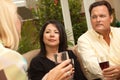 Three Friends Enjoying Wine on the Patio Royalty Free Stock Photo