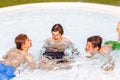Three friends have fun in the pool Royalty Free Stock Photo