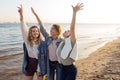 Three friends having fun on the beach, meeting friends. Young women Royalty Free Stock Photo