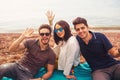 Three friends having fun at the beach, springtime Royalty Free Stock Photo