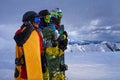 Three friends look forward snowboarders courageously