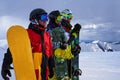 Three friends look forward snowboarders courageously