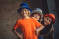 Three friends in party hats looking joyful Royalty Free Stock Photo