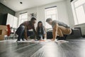 Three friends playing twister in the living room Royalty Free Stock Photo