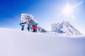 Three friends snowboarders, skier stands with ski and snowboard background blue sky with sun light, copy space Royalty Free Stock Photo