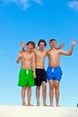 Three friends in swimmware stick together Royalty Free Stock Photo