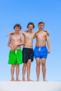 Three friends in swimware stick together