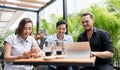 Three friends using devices connected to the wireless internet n