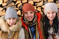 Three friends wearing winter clothes outdoor