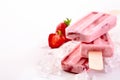 Three frozen popsicles with strawberry ingredients Royalty Free Stock Photo