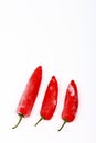 Three frozen red chilli peppers