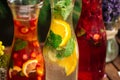 Three fruit and berry lemonades on the wooden tray