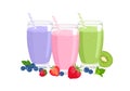 Three fruit smoothies in glasses and fresh strawberry, blueberry, kiwi. Healthy food concept. Royalty Free Stock Photo