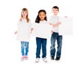 Three funny children holding paper blanks in hands