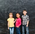 Three funny children with umbrella drawn on the blackboard