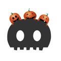 Three funny orange pumpkins on the scary skull