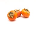 Three Fuyu persimmon isolated Royalty Free Stock Photo