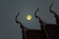 Three gable apexes and full moon the evening Royalty Free Stock Photo