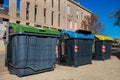 Three garbage recycling bins in a european street