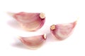 Three garlic cloves isolated on white background Royalty Free Stock Photo