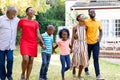 Three generation African American family spending time together in their garden. Royalty Free Stock Photo