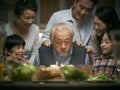 Three generation asian family celebrating grandpa`s birthday at home Royalty Free Stock Photo