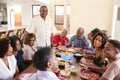 Three generation African American  family sitting at dinner table celebrating together,close up Royalty Free Stock Photo