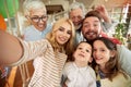 Three generation family having a good time while taking a selfie at home together. Family, leisure, together Royalty Free Stock Photo