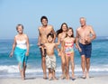 Three Generation Family On Holiday On Beach