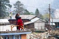 Local people on a roof of the house in Timang along Annapurna circuit trek, Nepal