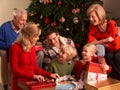Three Generation Family Opening Christmas Gifts Royalty Free Stock Photo