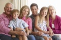 Three Generation Family Relaxing On Sofa At Home Royalty Free Stock Photo
