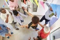 Three generation family throwing a surprise party welcoming guests at the front door,overhead view Royalty Free Stock Photo