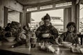 Three generation of a minority tribe having meal at Sapa Vietnam