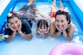 Three generation people swimming in Inflatable Pool at the summer time