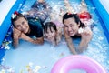 Three generation people swimming in Inflatable Pool at the summer time Royalty Free Stock Photo