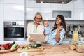 Three Generations Family. Grandma, mother and baby record a cooking vlog or podcast while chopping vegetables for a healthy Royalty Free Stock Photo