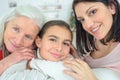 Three generations family resting on couch Royalty Free Stock Photo