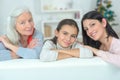 Three generations family resting on couch Royalty Free Stock Photo