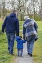 Three generations grandmother, son and grandson to walk through the park in the spring, Zoetermeer, Netherlands Royalty Free Stock Photo