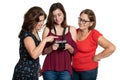 Three generations of hispanic women looking at photpgraphs on a digital camera Royalty Free Stock Photo