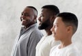 Three Generations Of Men. Happy Black Granddad Looking At Son And Grandson Royalty Free Stock Photo