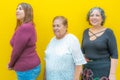 Three generations of Mexican women smiling in casual clothes Royalty Free Stock Photo